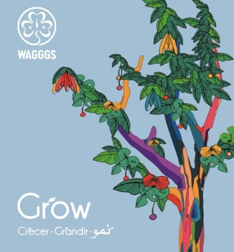 WAGGGS Grow-logo med fargerikt tre mot blå bakgrunn